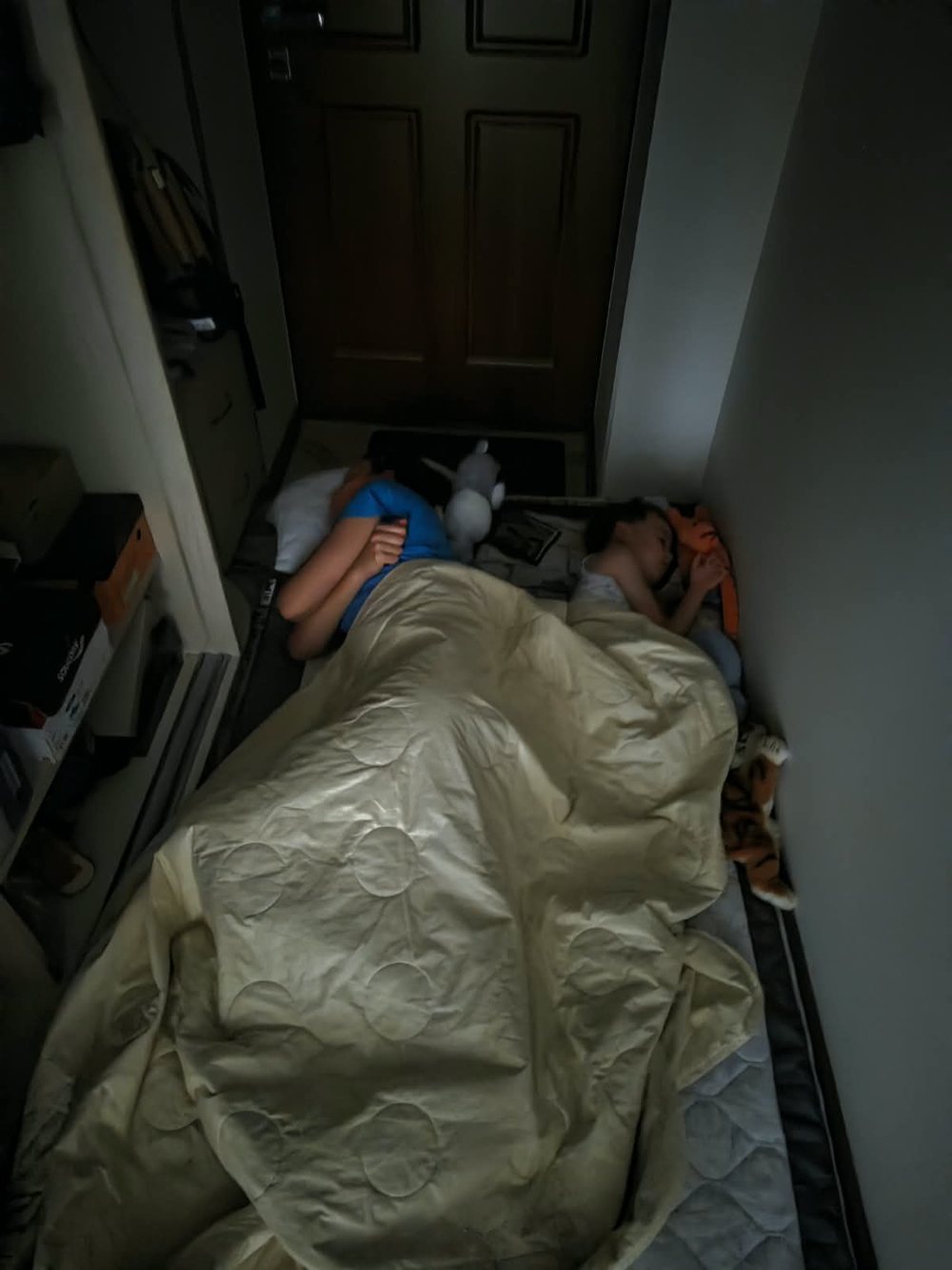 Children of the Ukrainian broker sleeping on the corridor floor in Kyiv during an air-raid alert