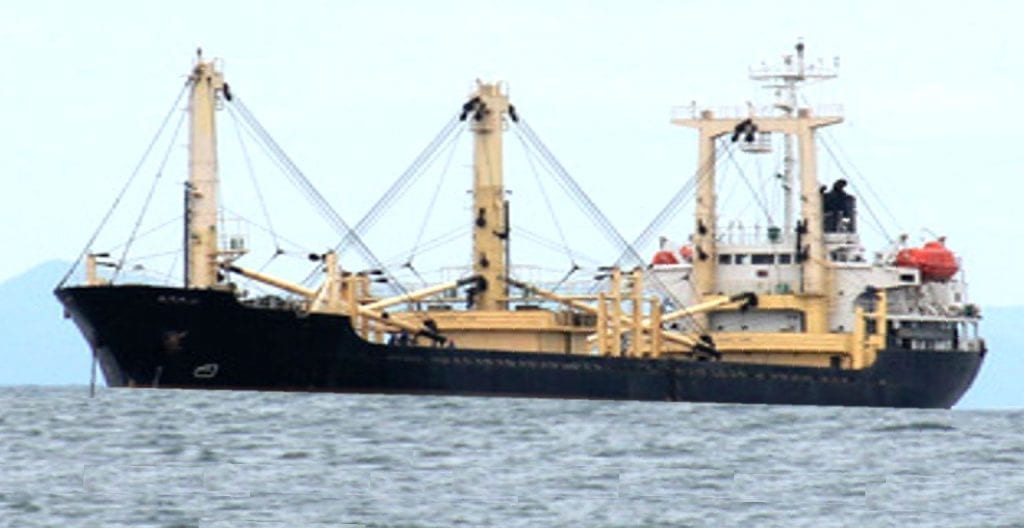 Geared general cargo ship with its own derricks for loading and discharging
